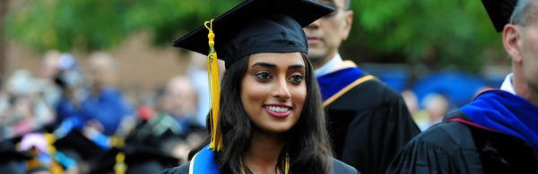 Graduate wearing cap and gown 