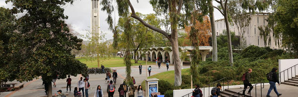 UCR Campus students walking Bell Tower in background (c) UCR/Stan Lim