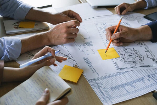 people collaborating, zoom in on arms and table (c) pexels